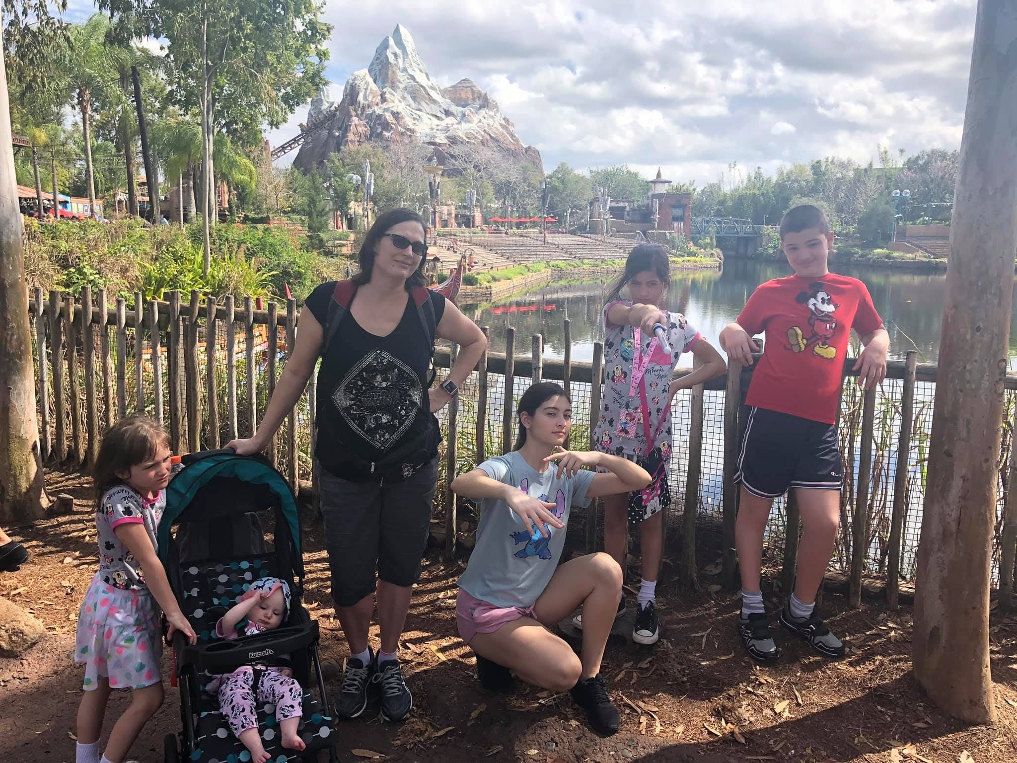 Pam, Chris, and their family during a Disney trip