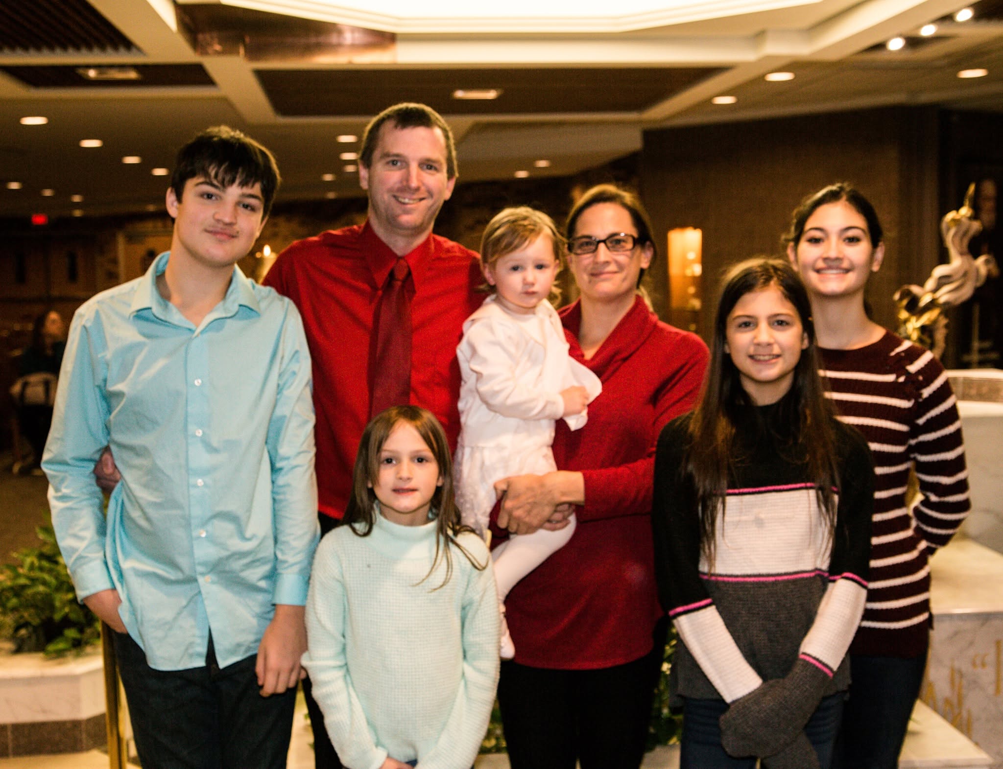 Formal portrait of Pam, Chris, and their family